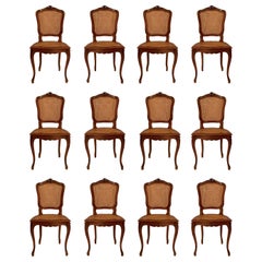 Set of 12 Antique 19th Century French Carved Walnut Dining Chairs.