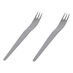Arne Jacobsen for Georg Jensen. Two long salad forks in stainless steel.
