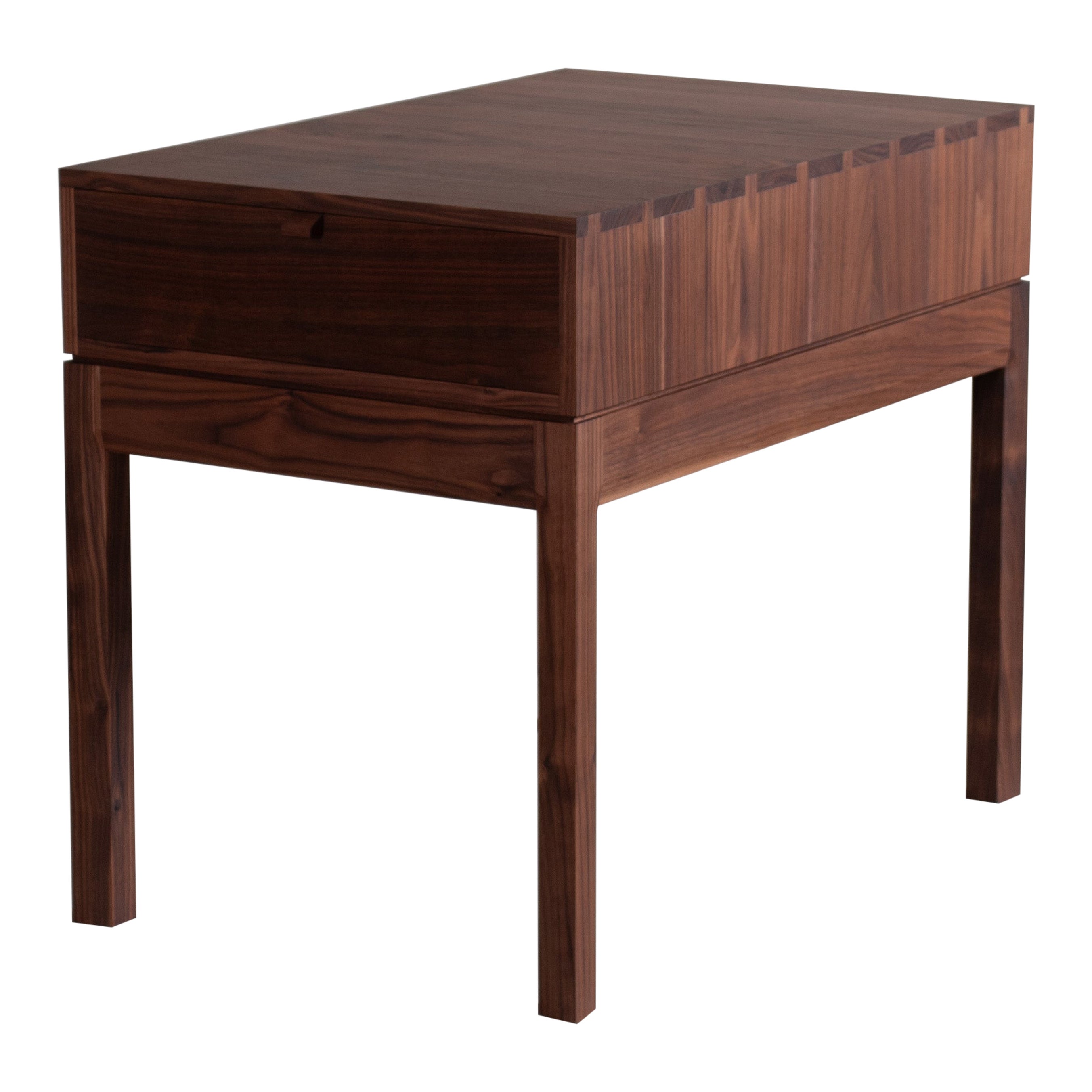 A new version, with a secret compartment, of our American black walnut hand-crafted nightstand tables . These are constructed from the finest American black walnut with the inner traditionally dovetailed jointed drawer in prime English Oak. The