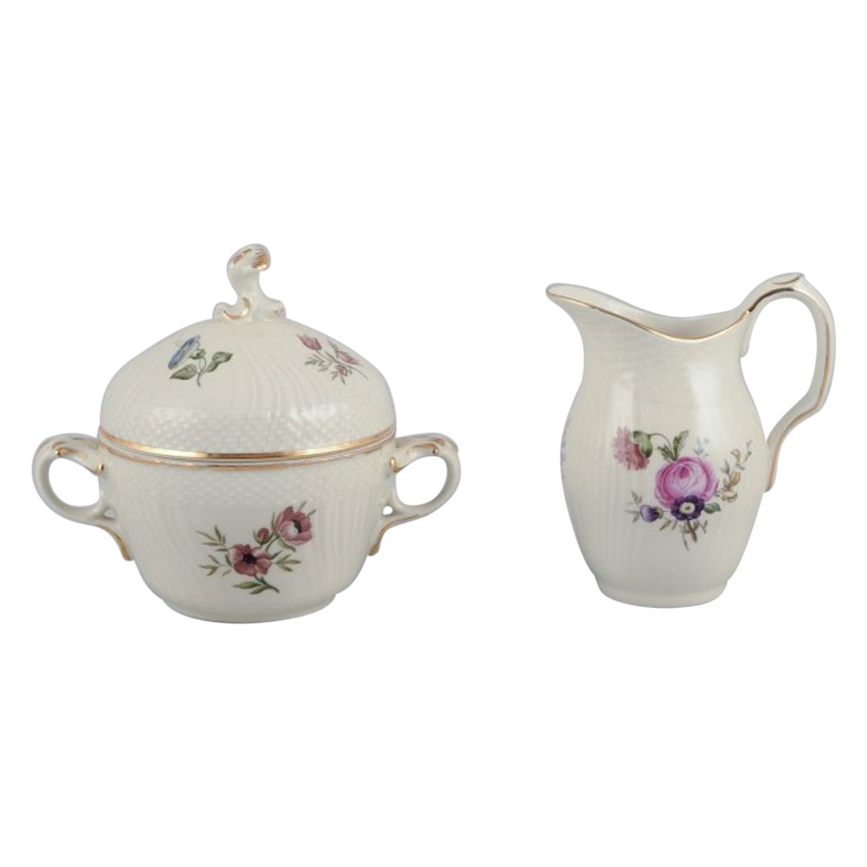 Royal Copenhagen, "Frijsenborg". Azucarero y cremera con motivo floral