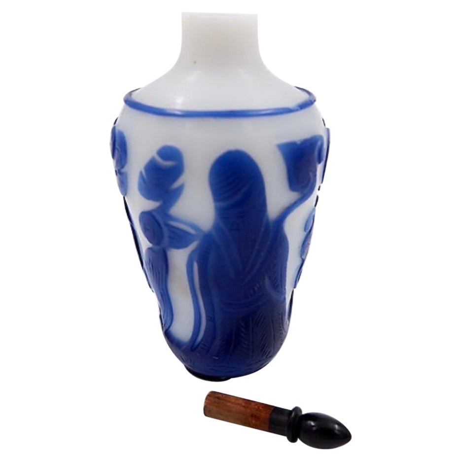 Clear glass snuff bottle with blue overlay, China 19th century