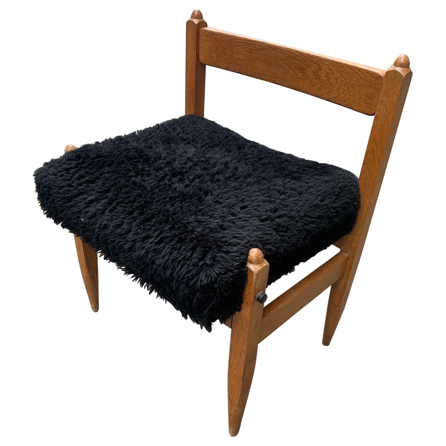 An oak stool by Guillerme et Chambron