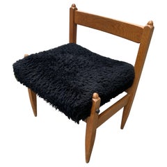 An oak stool by Guillerme et Chambron