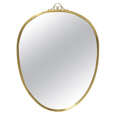 Beautiful small heavy Mid Century brass wall mirror by Münchner Zierspiegel