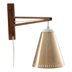Wooden wall sconce with swivel arm