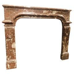 Mantle fireplace, carved in veined Red marble with vents, France