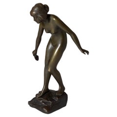 An Art Deco Bronze Sculpture of a Young Woman