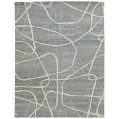 Tapis de laine abstrait contemporain fait main en gris