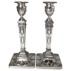 Pair Of Sterling Silver Neoclassical Candlesticks Decorated with Urns