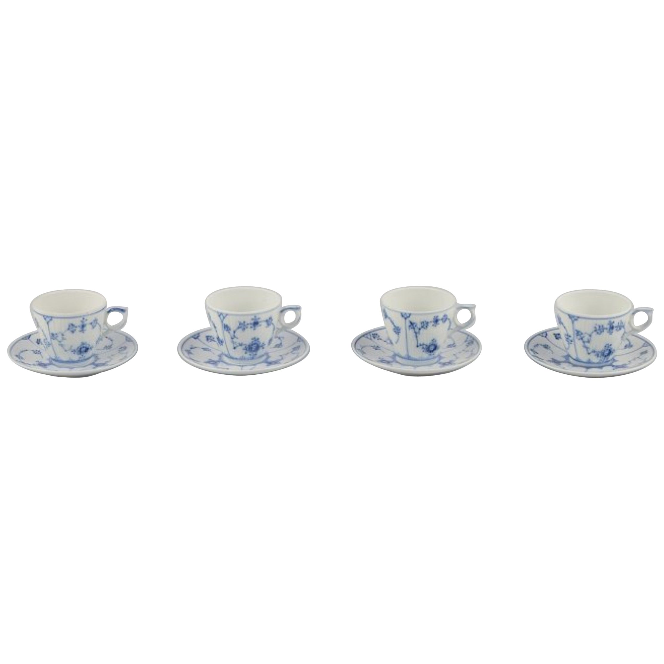 Royal Copenhagen Blue Fluted Plain. Four porcelain coffee cups with saucers.