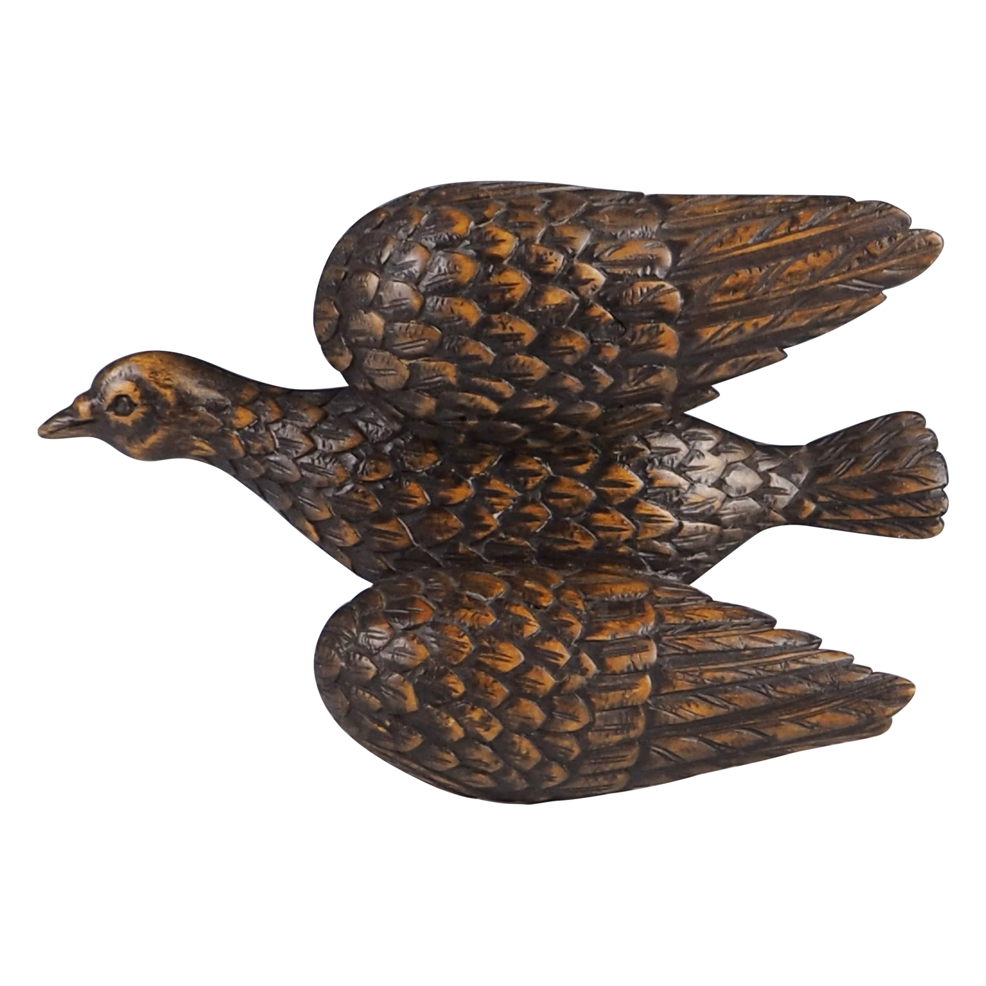 Antiguo pájaro decorativo tallado