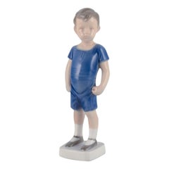 Bing & Grondahl porcelain figurine. Standing boy.  Ca. 1930s. Model number: 1617