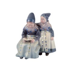 Royal Copenhagen figurine in porcelain. Two "Amager" girls in regional costume.