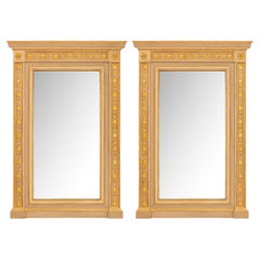 pair of Italian 18th century Louis XVI Period patinated and Giltwood mirrors