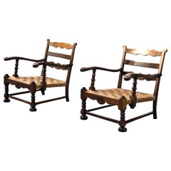 Pair of 1940ties Danish cabinet maker lounge chairs in dark oak.