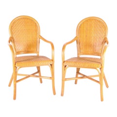 Pair of rattan and hand woven leather armchairs
