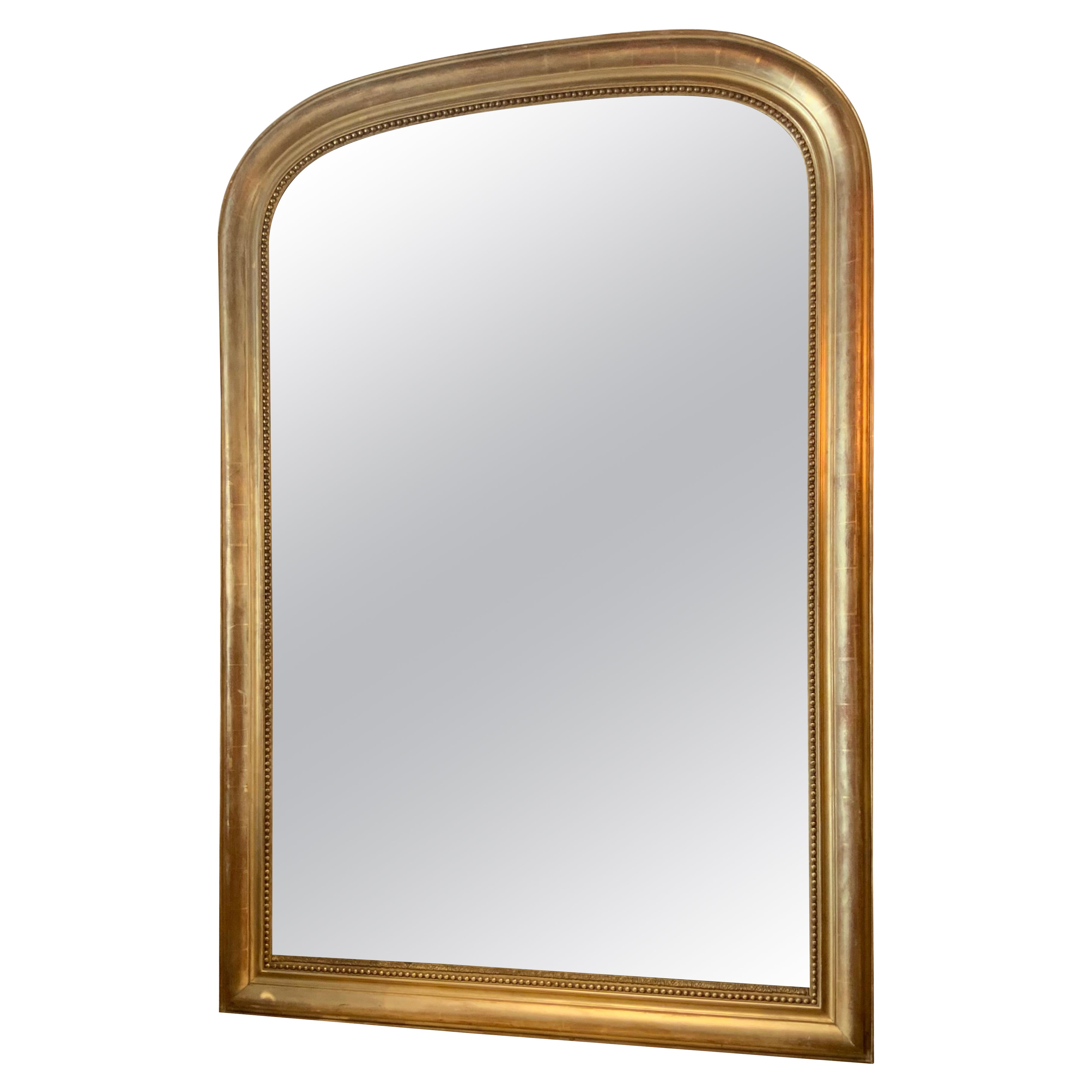 Grand miroir en bois doré d'époque Louis Philippe