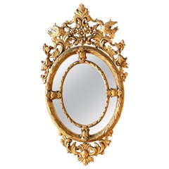 Miroir ovale en bois doré d'époque Empire, 19e siècle
