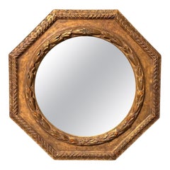 Miroir octogonal en bois doré de style Régence Paul Ferrante