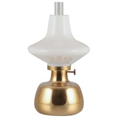 Henning Koppel for Louis Poulsen.  Petronella oil lamp in brass with opal glass