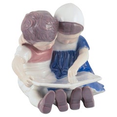 Bing & Grondahl, Denmark. Porcelain figurine of reading children.