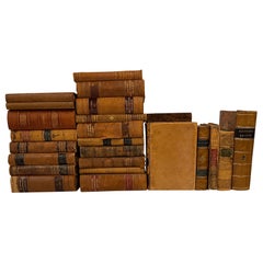 Groupe de 25 livres reliés en cuir ou marbrés assortis, 19e siècle