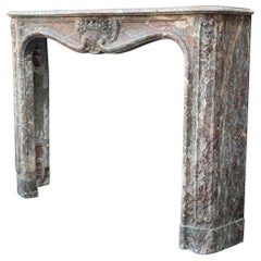 Mantello Regence del XVIII secolo con cesto floreale in marmo grigio Ardennes