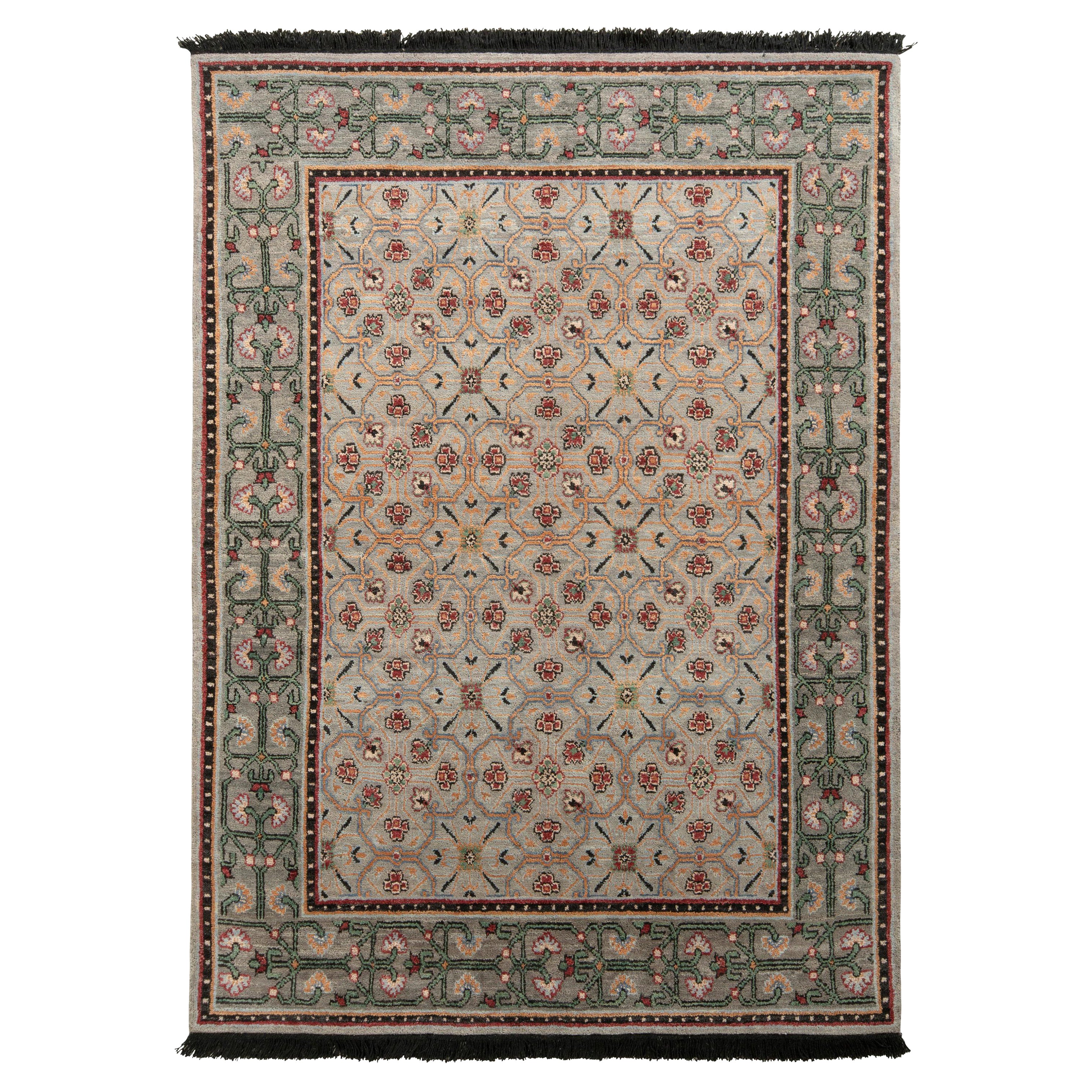 Rug & Kilim è un tappeto in stile transitorio con motivi floreali in verde e blu.