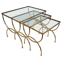 Neoclassical style brass nesting tables  with arcuate base. French work