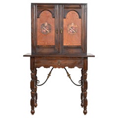 Baker Furniture Spanish Colonial Carved Oak Leather Front Bookcase or Cabinet