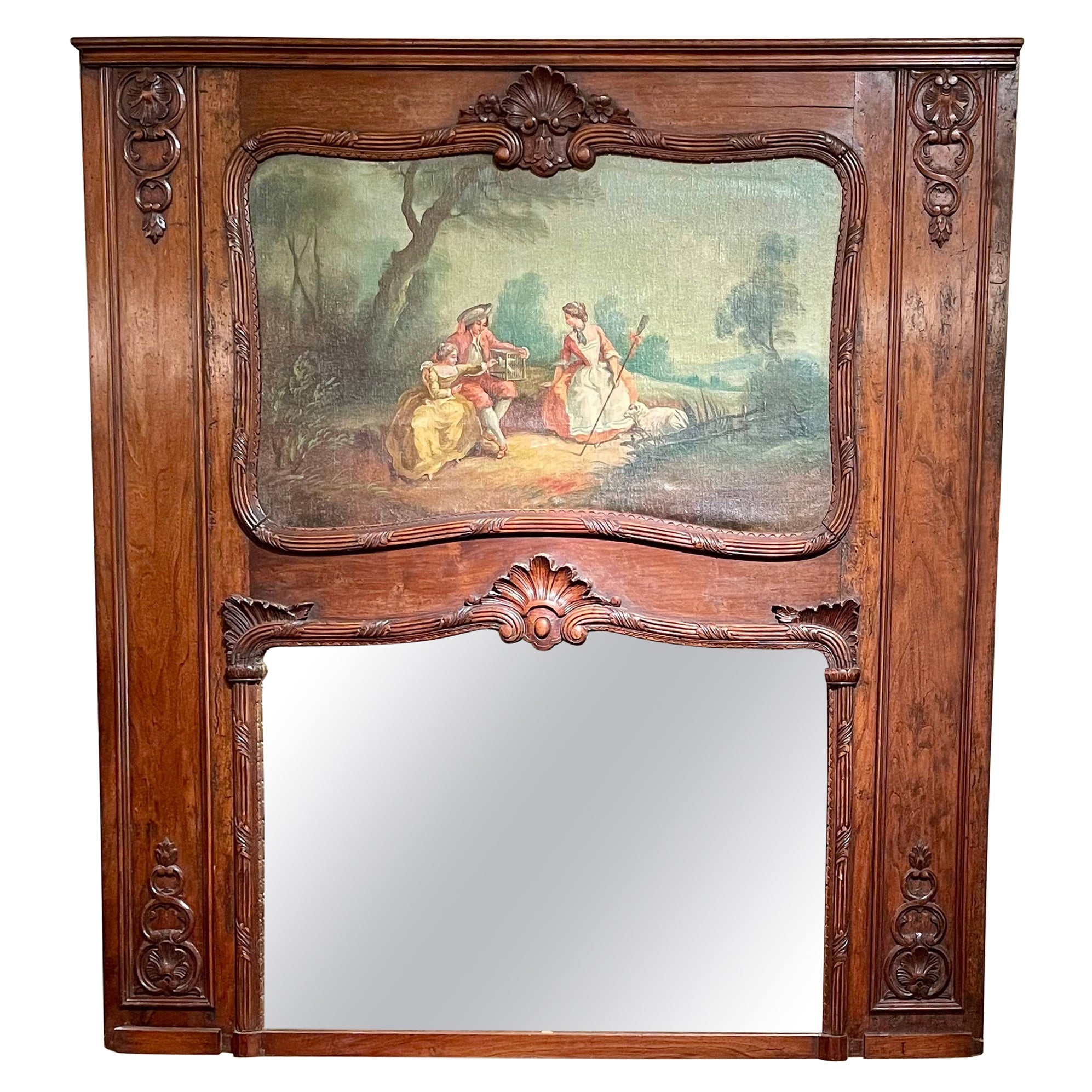 Antique 19th Century French Carved Walnut Trumeau Mirror with Pastoral Scene.