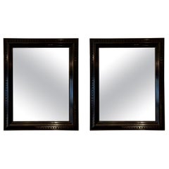Pair of Ebonised Carved Wood Mirrors