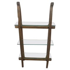 Antique sled bookcase from the first half of the 20th century with glass shelves