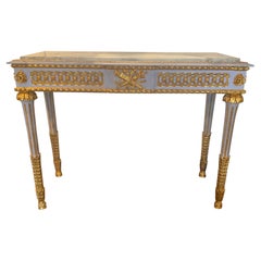 Pair of Neoclassical Style parcel gilt and gray painted marble top consoles