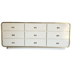 Postmodern Cream Lacquer Laminate Waterfall Dresser With Gold Accents