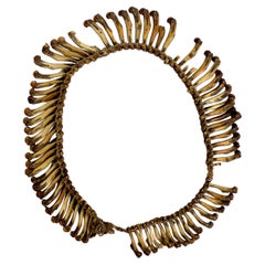 Una collana di trofei cerimoniali Asmat