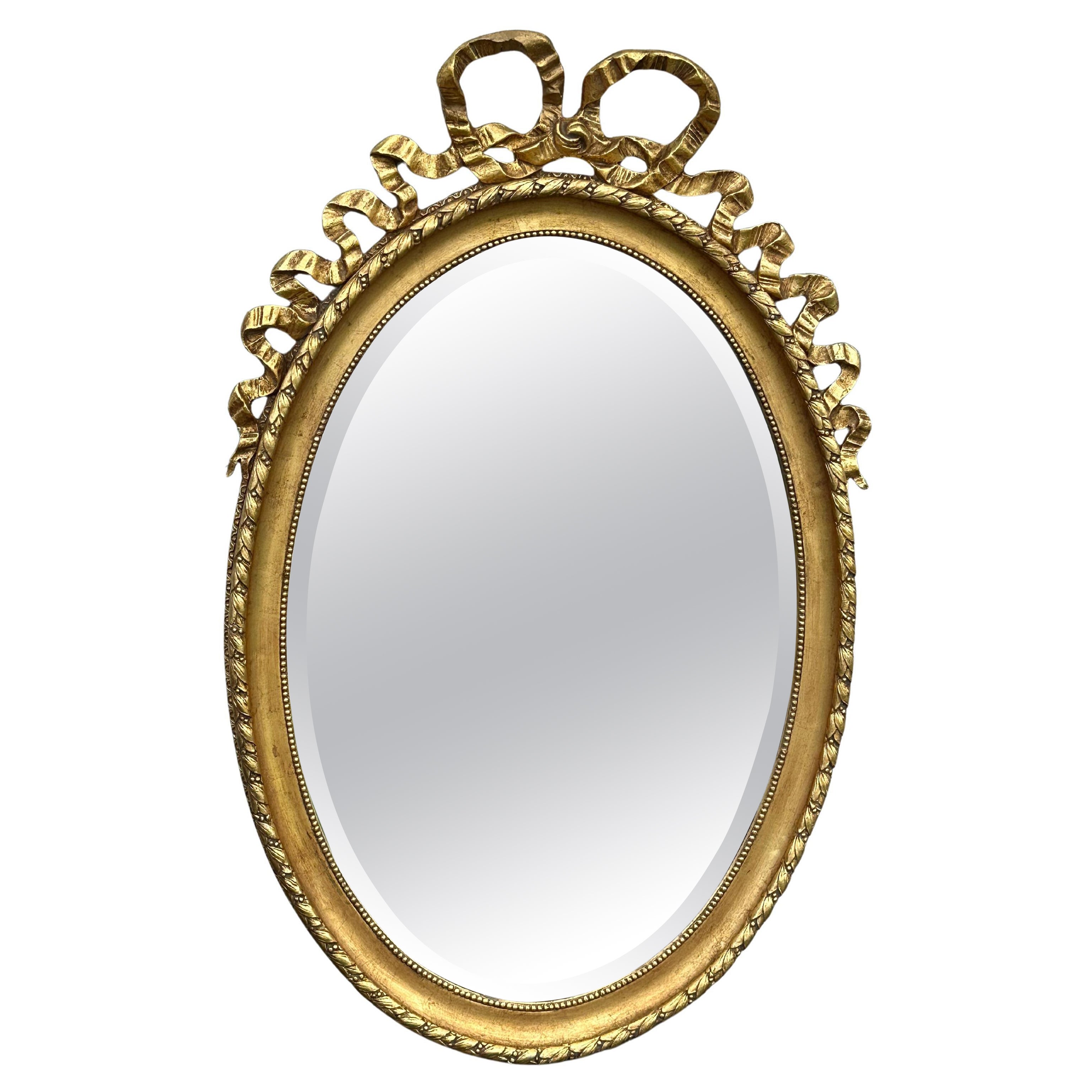 19th Century French Louis XVI Style Gilt Wood Oval Mirror with Knotted Ribbon en vente