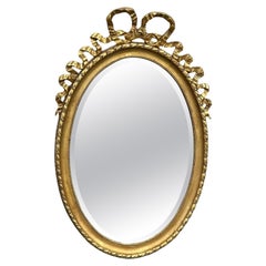 Antique 19th Century French Louis XVI Style Gilt Wood Oval Mirror with Knotted Ribbon