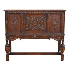 Baker Furniture Jacobean Carved Oak Sideboard Buffet or Bar Cabinet, Circa 1920s