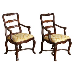 Pair Italian, Genovese, Rococo Period Shaped Walnut Poltrone, mid 18th century