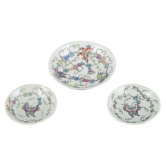 China, three porcelain bowls. Classic motifs with flowers and butterflies.