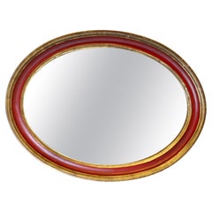 Large Oval Gilt and Red Wall Mirror  This Mirror has a 3" wide moulded oval fram
