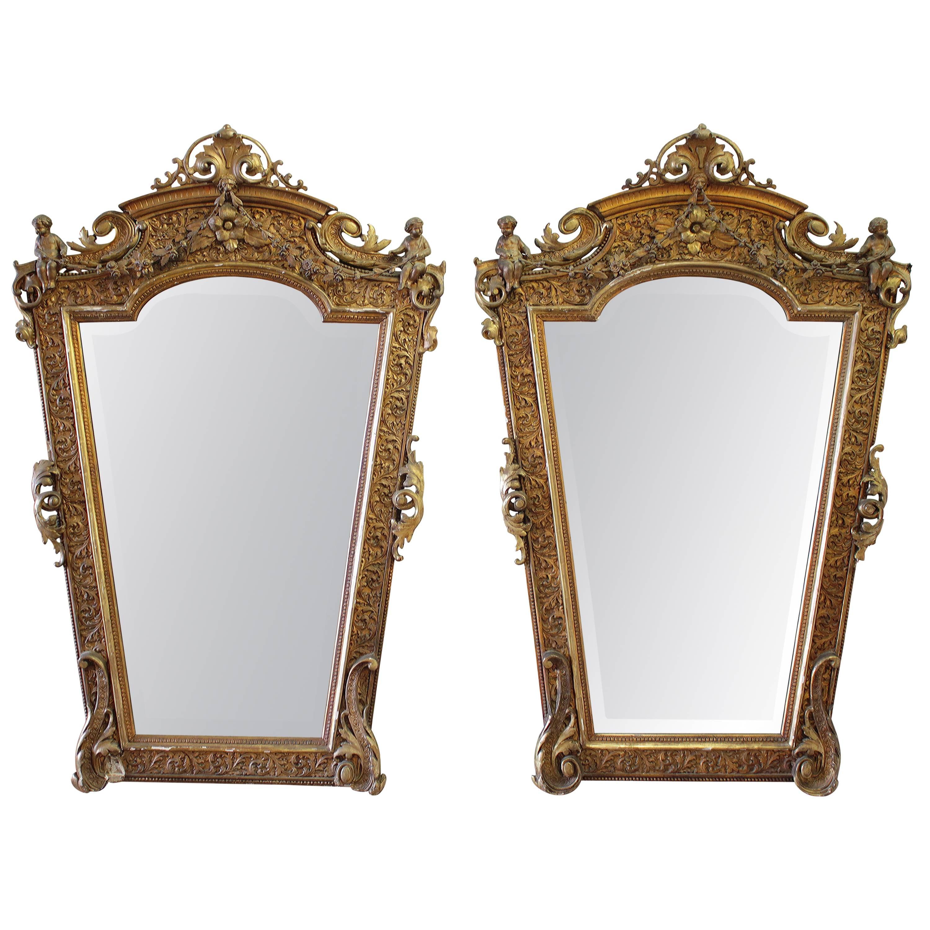 Rare French 19th Century Pair of Giltwood Cherub Mirrors For Sale