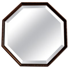 Arts & Crafts / Art Deco antique octagonal wall mirror with beaded wood frame.