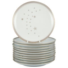 Bing y Grondahl, "Vía Láctea". Conjunto de once platos con decoración dorada.