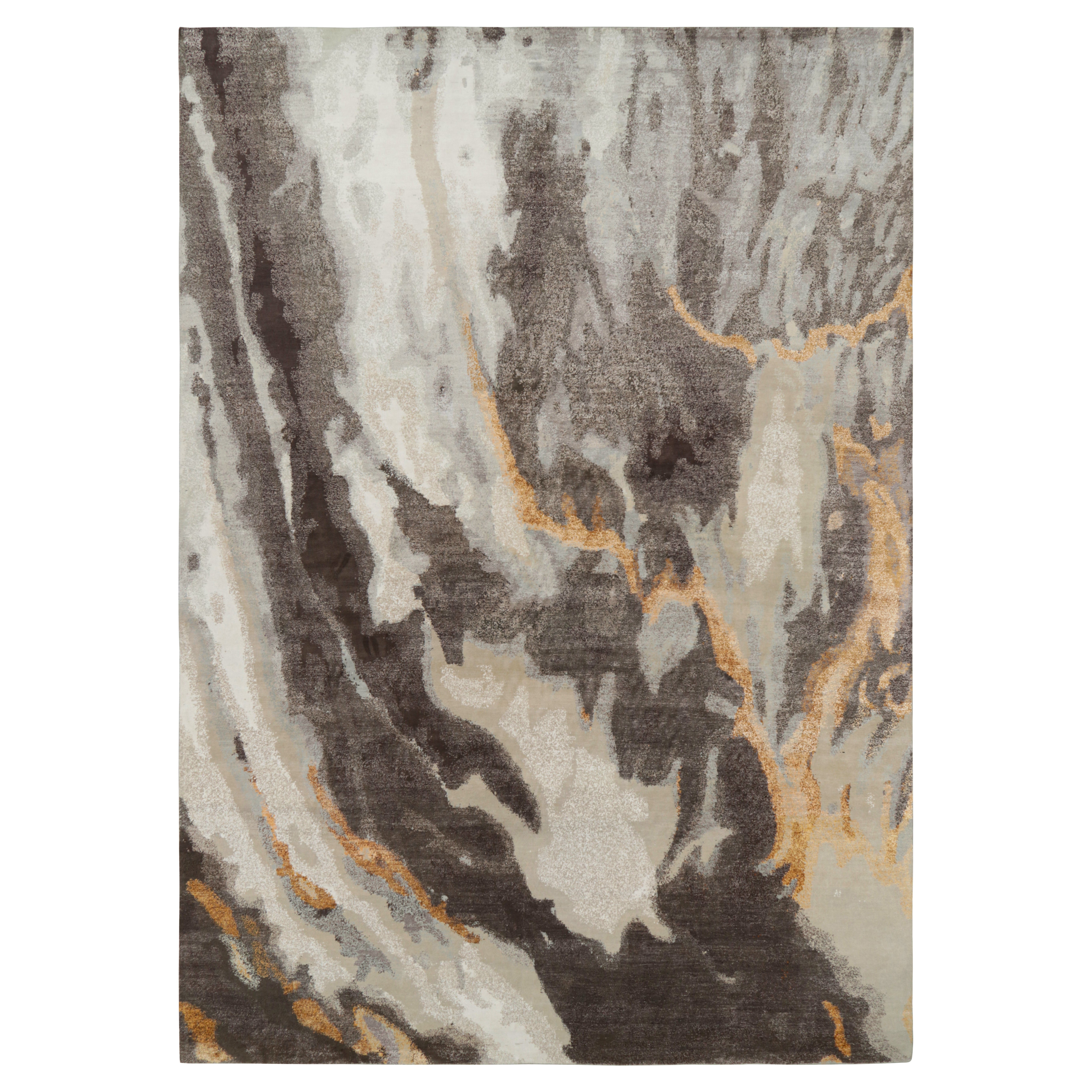 Rug & Kilim’s Oversized Abstract Rug in Blue, Gray and Gold Tones