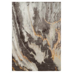 Rug & Kilim’s Oversized Abstract Rug in Blue, Gray and Gold Tones