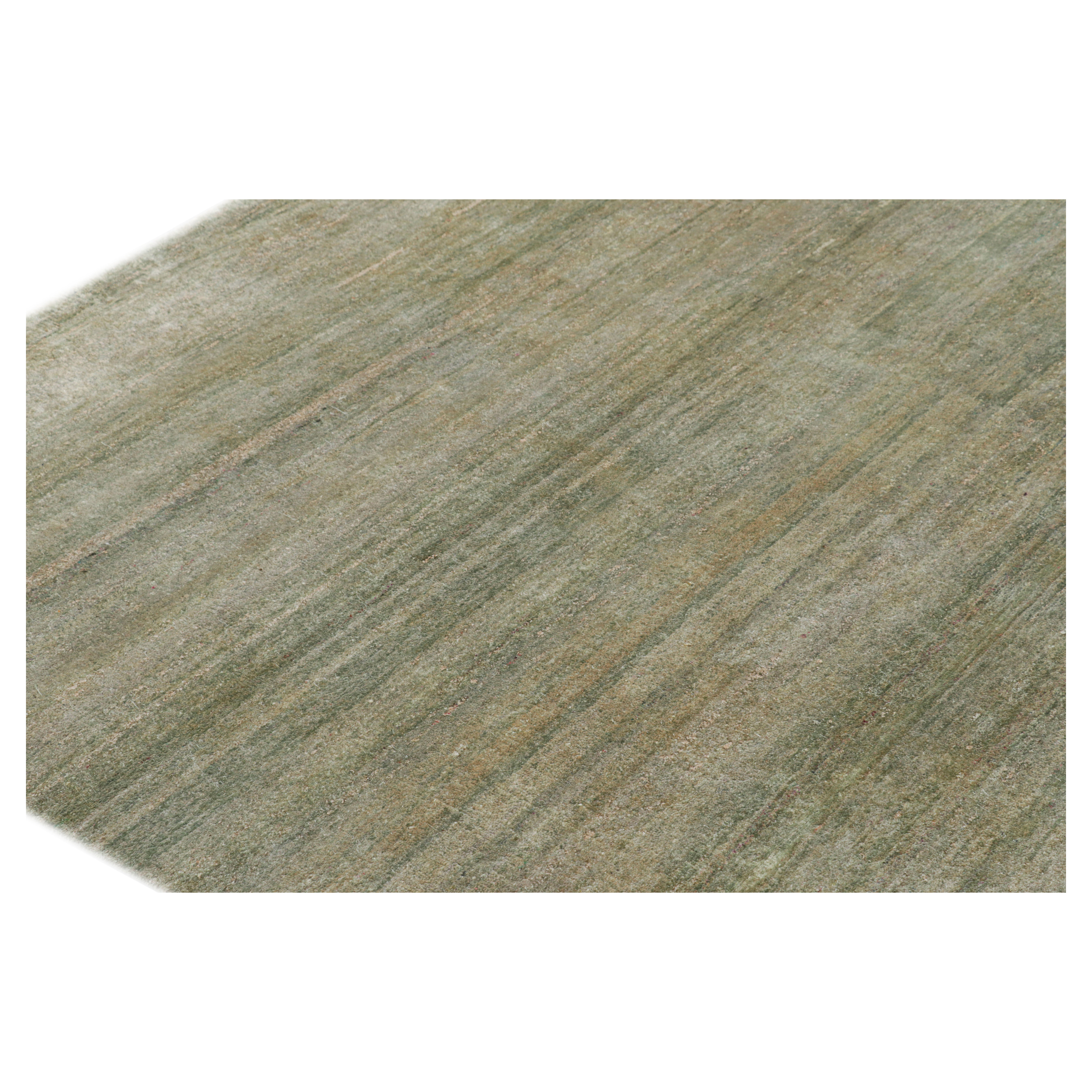Rug & Kilim’s Oversized Textural Rug in Light Green Tones and Striae