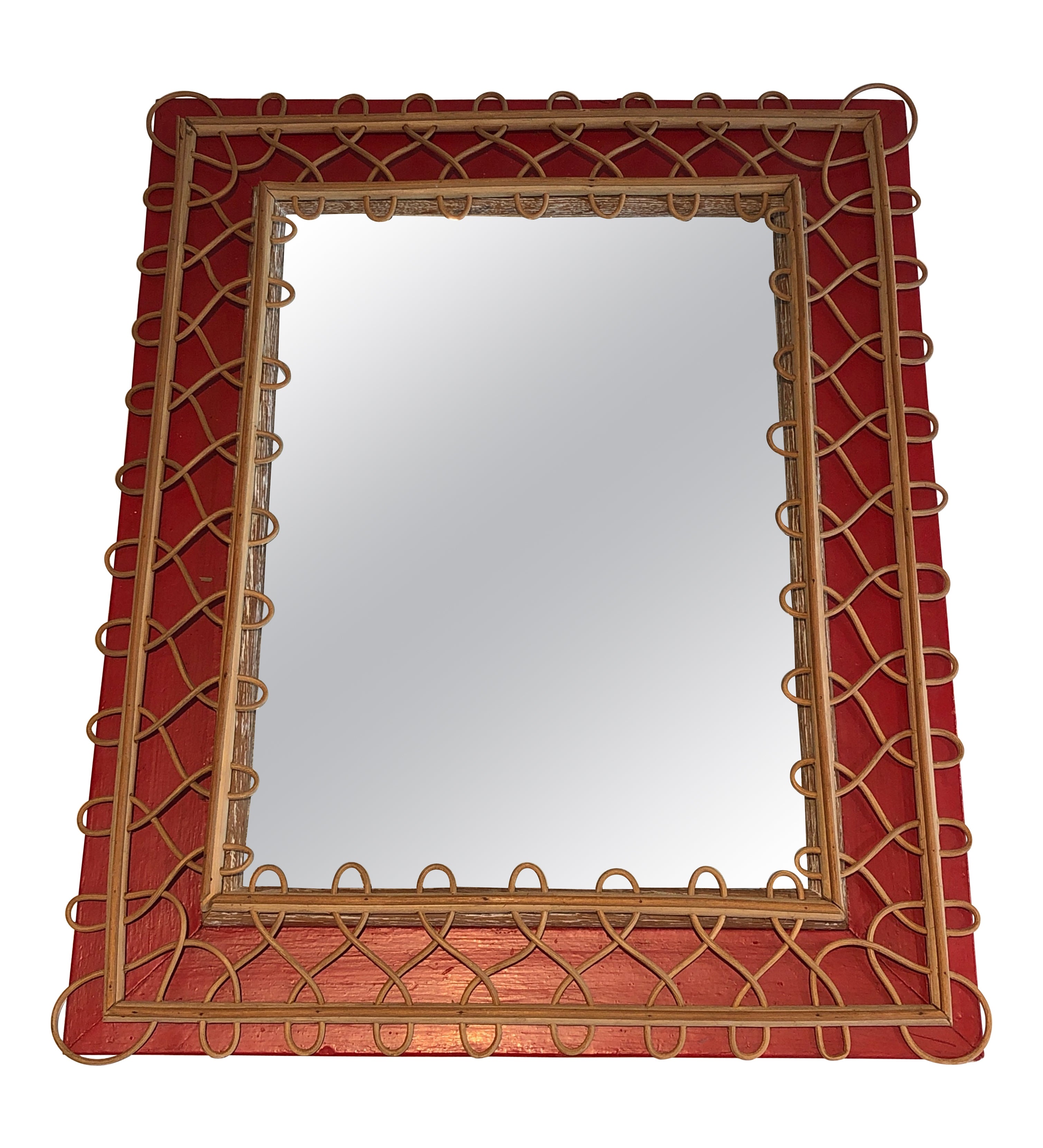Miroir en rotin sur fond rouge. Travail français. Circa 1940