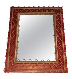 Miroir en rotin sur fond rouge. Travail français. Circa 1940